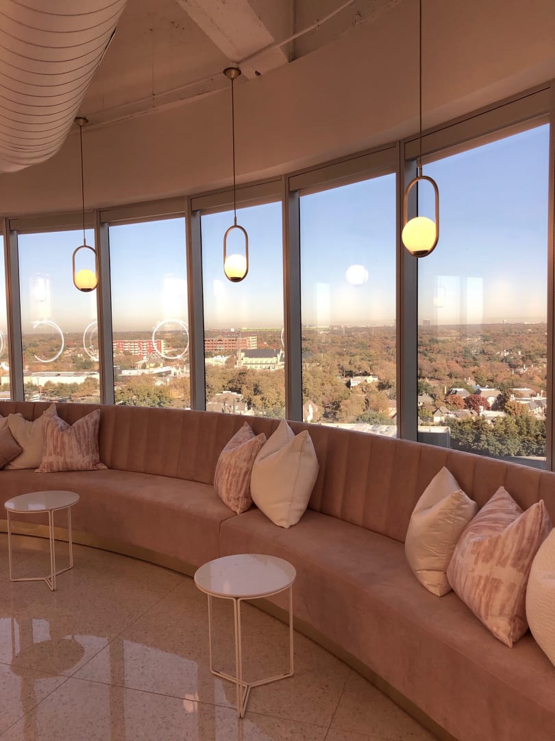 pink banquette with throw pillows